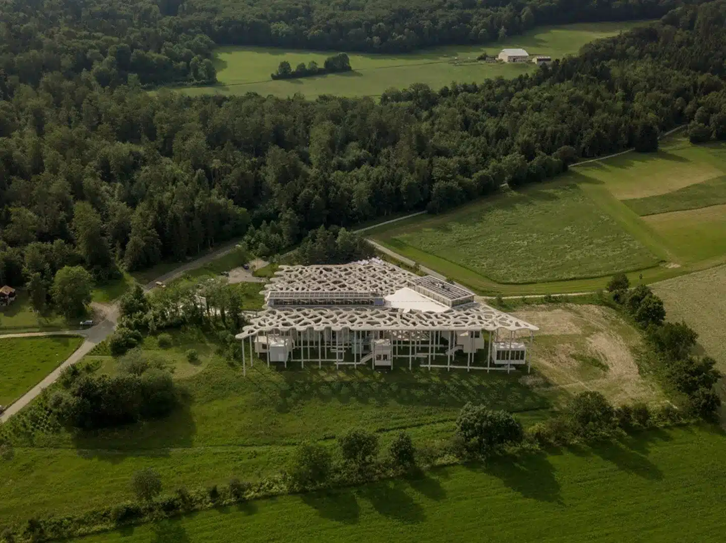 Aerial view of the Jan Michalski Foundation complex integrated into the Swiss countryside landscape
