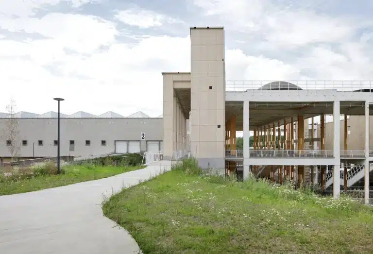 Charleroi Palais des Expositions exterior landscape with green park and exposed concrete structure