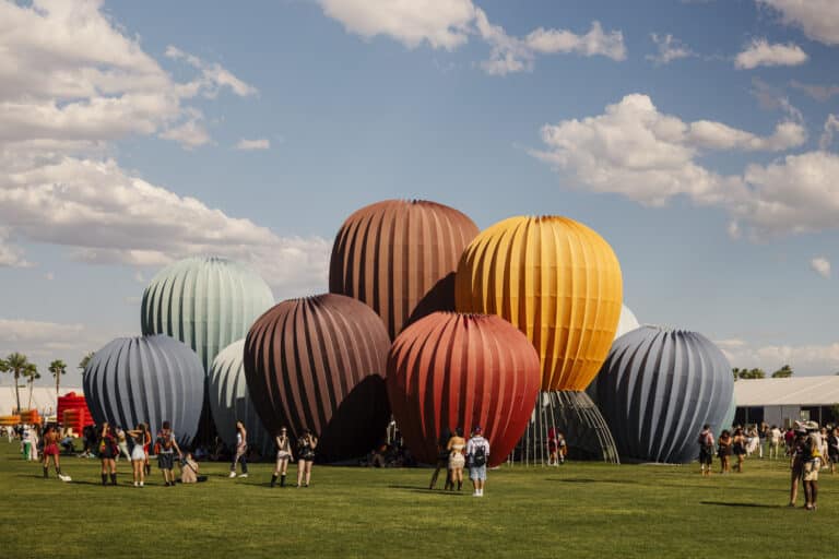 Coachella 2026 festival grounds with art installations and crowd at Empire Polo Club
