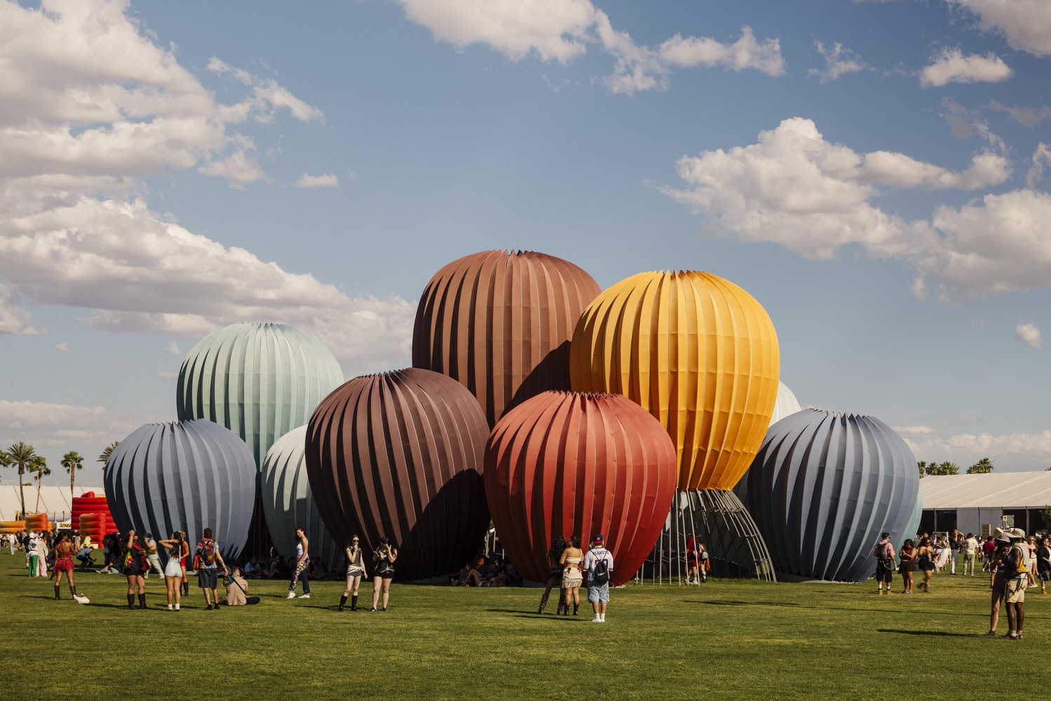 Coachella 2026 festival grounds with art installations and crowd at Empire Polo Club