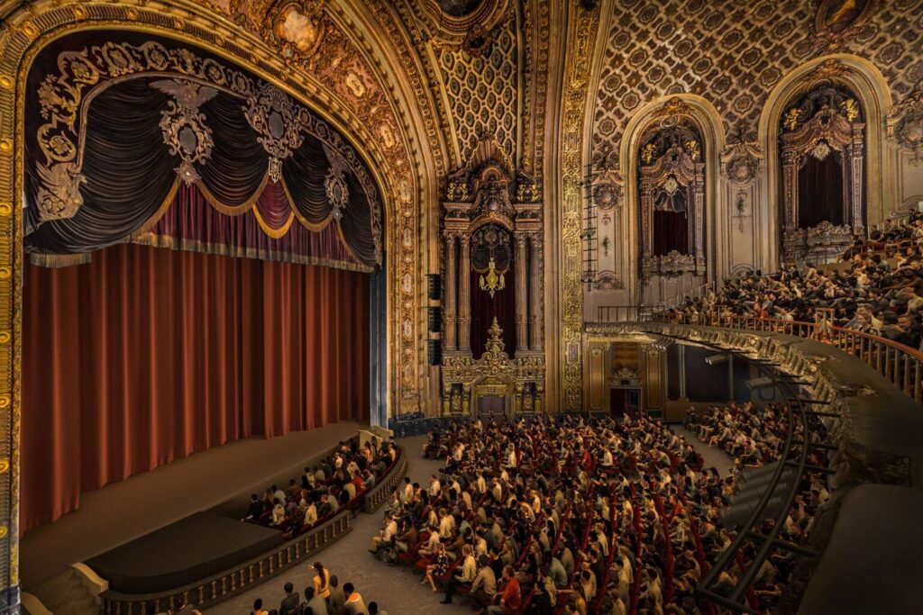 The grand auditorium of the restored Loews Theater in Jersey City, showing the stage and seating capacity.