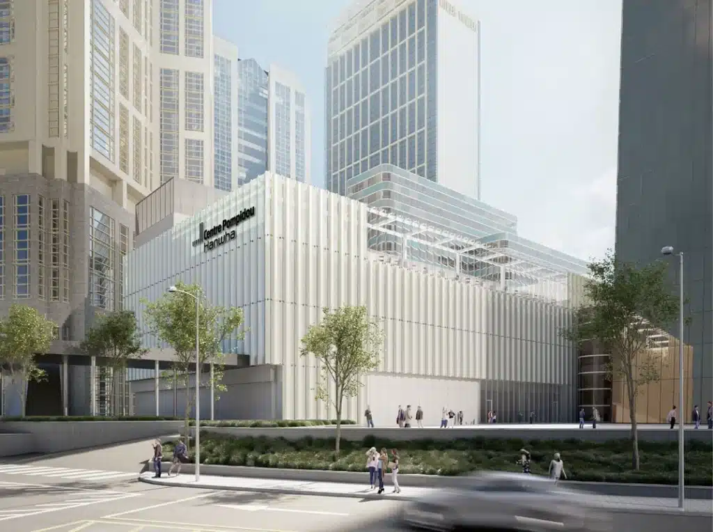 Street-level view of the Centre Pompidou Hanwha's main entrance with a crosswalk in the foreground.