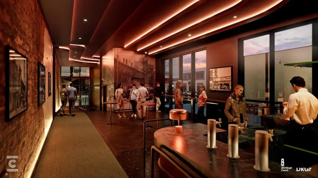 Corridor in the Crump Theatre's eastern expansion, showing the original 1871 brick wall opposite a new glazed brick wall.