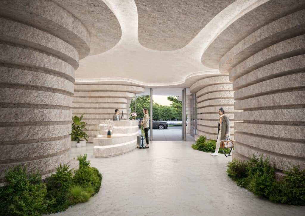 Qapital Tower lobby interior with curved stone-textured columns and organic ceiling