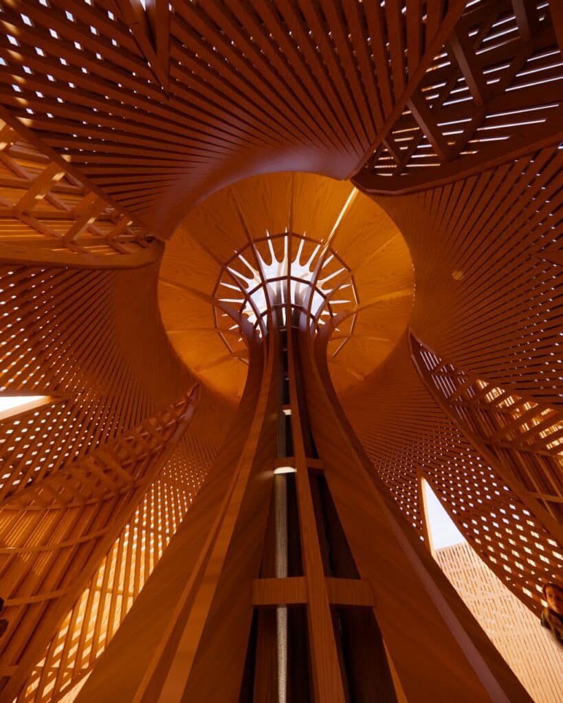 الفراغ الداخلي لمعبد القمر في بيرنينج مان 2026 مع زوار يجلسون بين عوارض خشبية منحنية وإضاءة دافئة