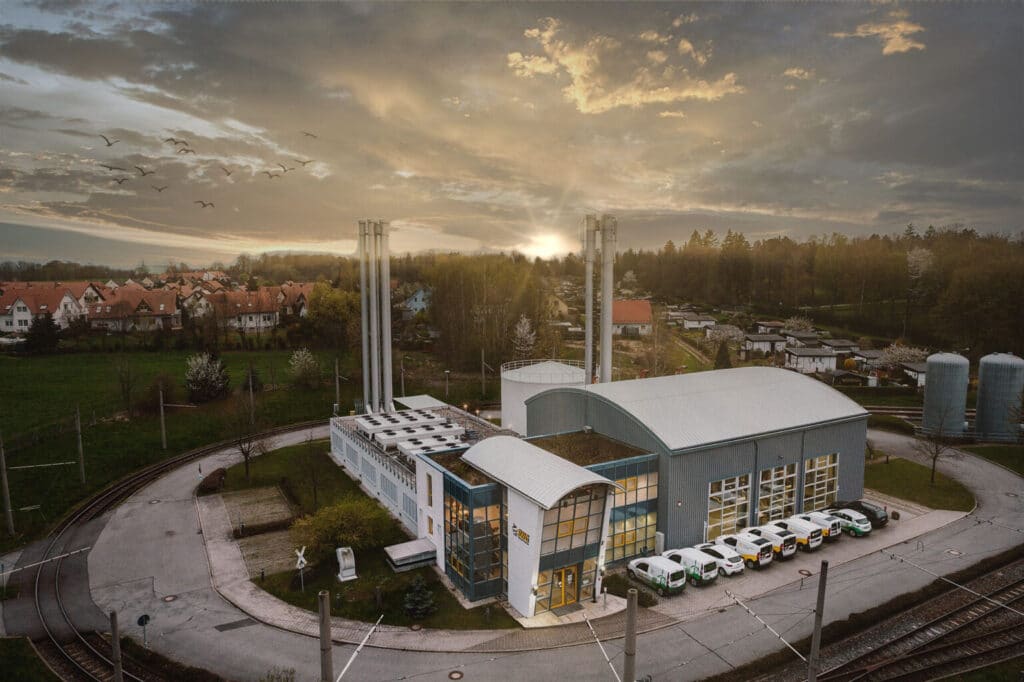 Aerial view of district heating plant facility in Görlitz with industrial chimneys and surrounding residential area