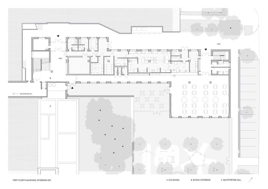 First-floor plan of the school extension showing the wide corridor and classroom distribution.