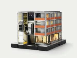 Modern industrial miniature apartment building integrated into a De’Longhi Eletta Ultra coffee machine.