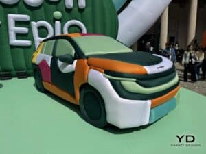 Three-quarter front view of the Skoda Epiq electric car covered in colorful inflatable textile panels at Milan Design Week.