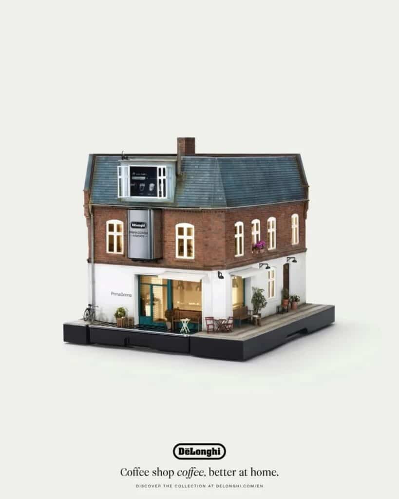 Classic brick building miniature cafe featuring a De&rsquo;Longhi PrimaDonna coffee maker.