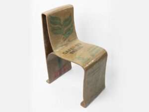 Perspective view of the Novum Chair featuring a bio-composite structure made from natural woven fibers and bio-sourced resin.