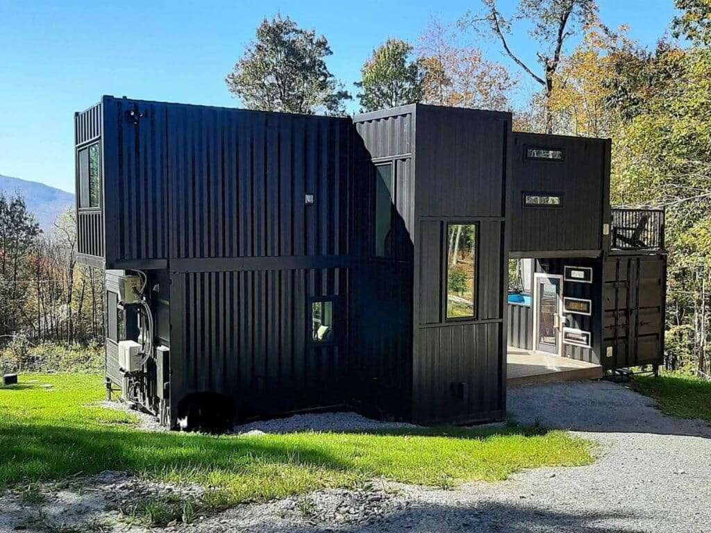 Side angle of the Fairmont Villa container house showing the structural cantilever and integrated HVAC systems.