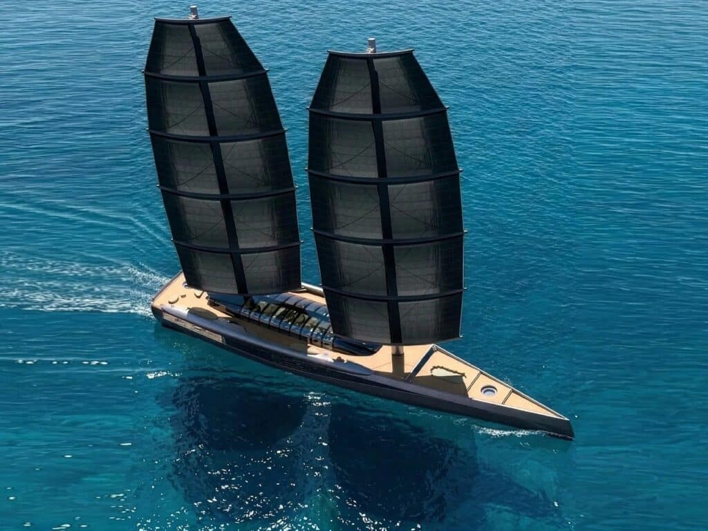 Wide-angle bird's-eye view of the A100 sailing yacht cruising, showcasing the full deck length and aerodynamic sail configuration.