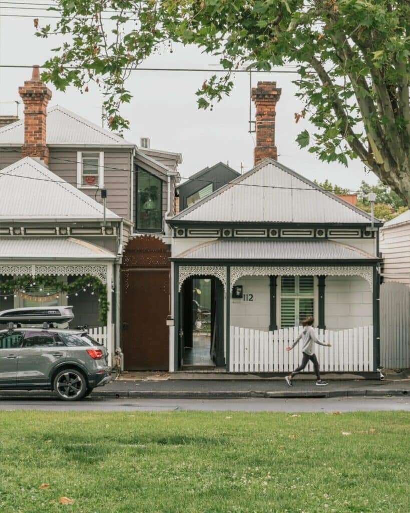 Exterior view of a Victorian worker's cottage in Abbotsford with a modern rear extension visible behind the heritage roofline.
