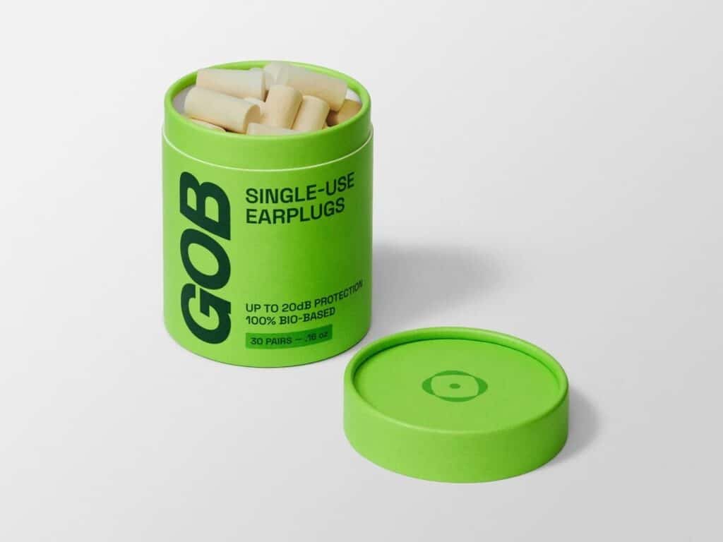 GOB sustainable earplugs packaging in a bright green cylindrical tube made from bio-based materials for noise reduction.