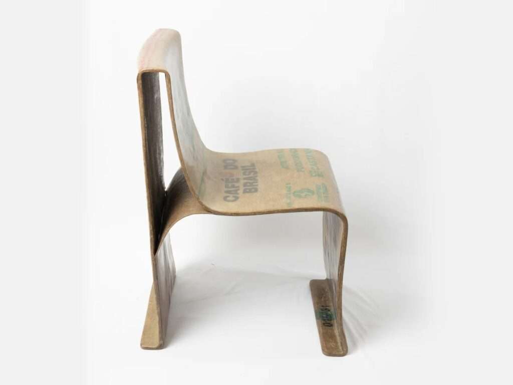 Side profile of the Novum Chair showing its sleek, continuous ergonomic curve and bio-material composition.