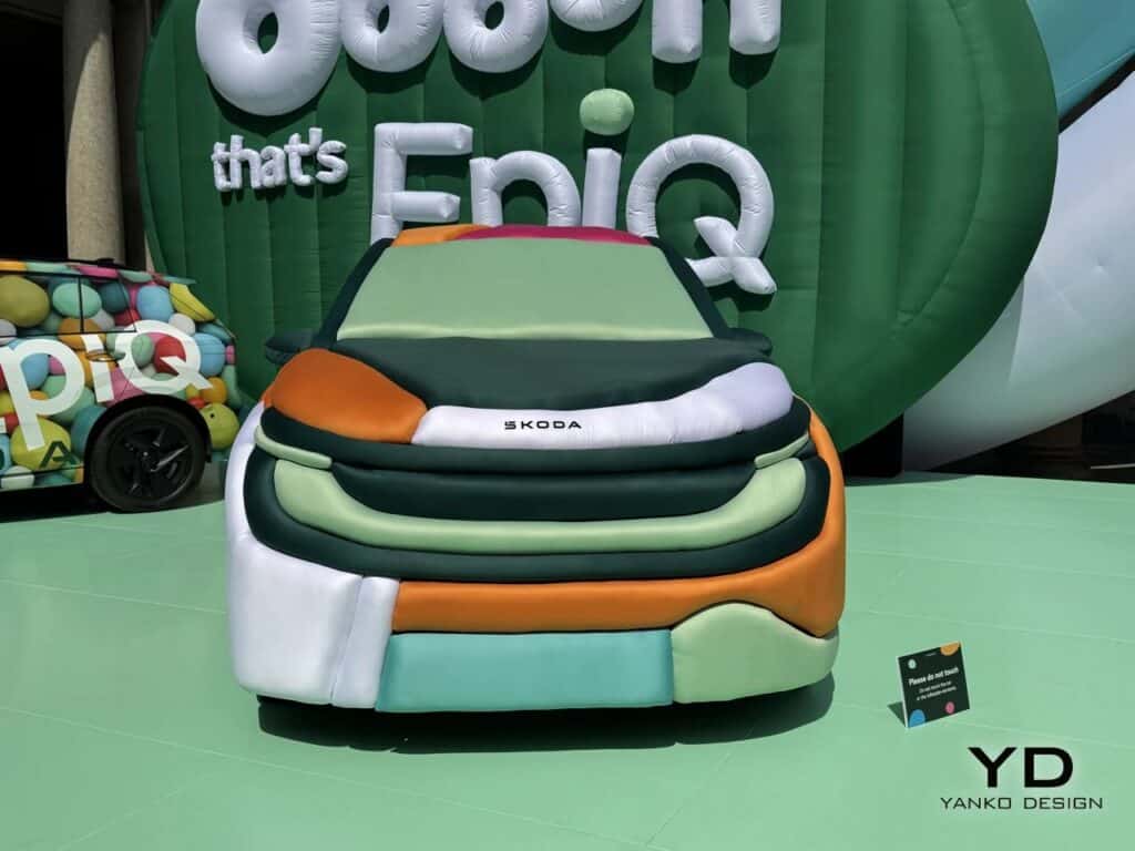 Direct front view of the Skoda Epiq featuring green, orange, and white inflatable layers.