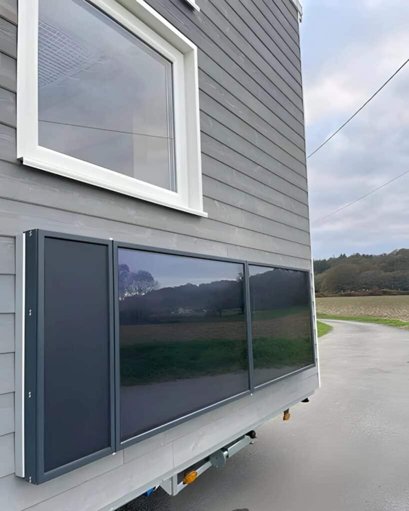 Close-up of solar air heater panels installed on the exterior wall of V&eacute;ronique tiny house.