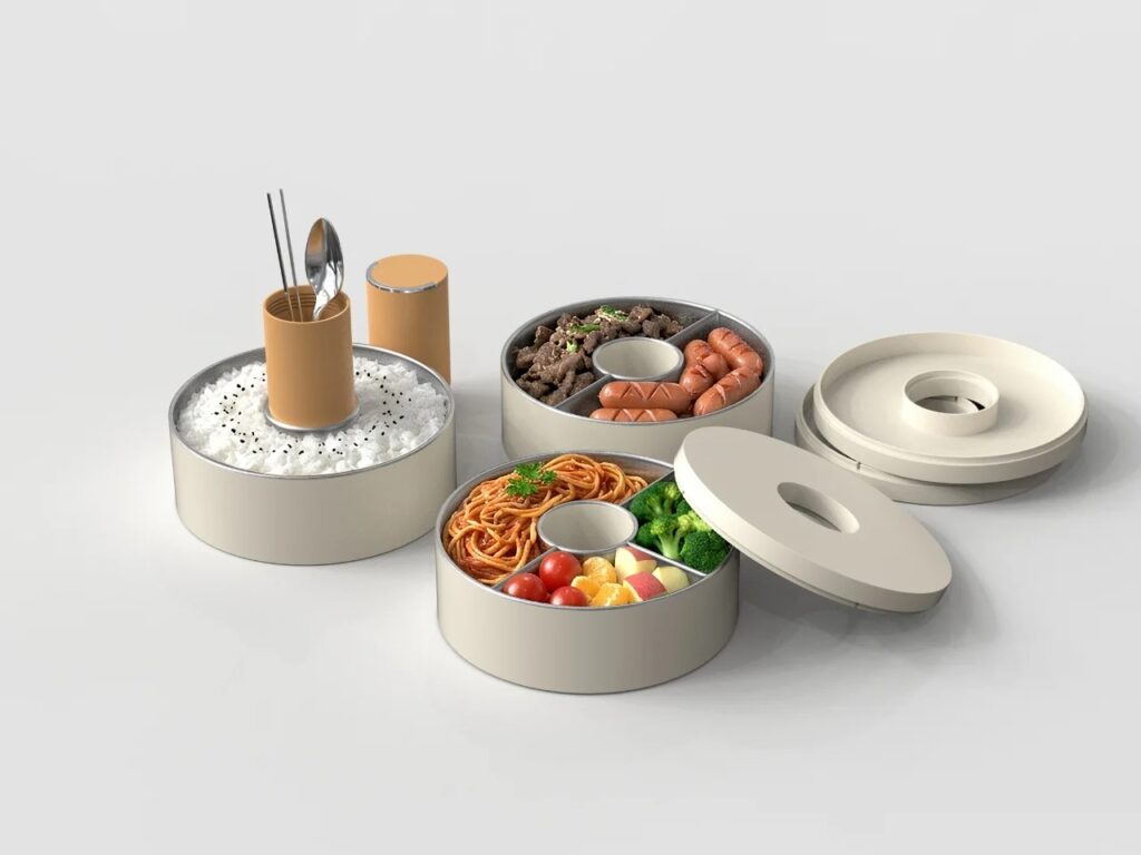 Lunch Box containers opened and filled with various foods, showcasing the central utensil holder as a structural pivot.