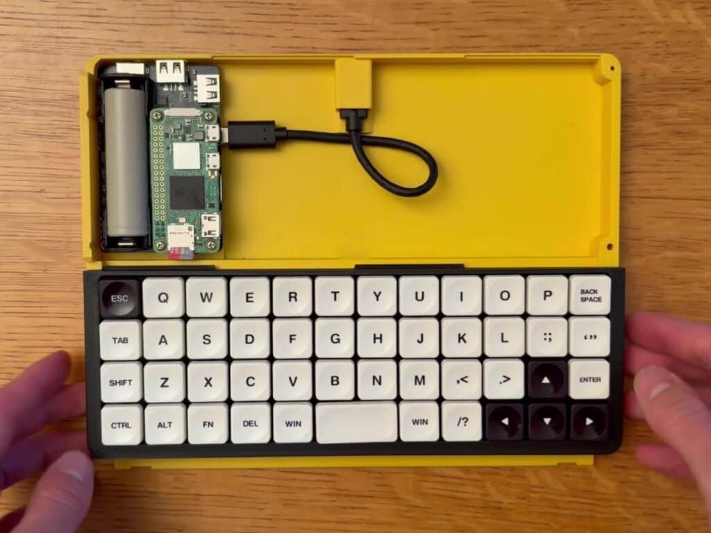 Internal view of the Bee Write Back showing the Raspberry Pi Zero connected to the keyboard and power module.