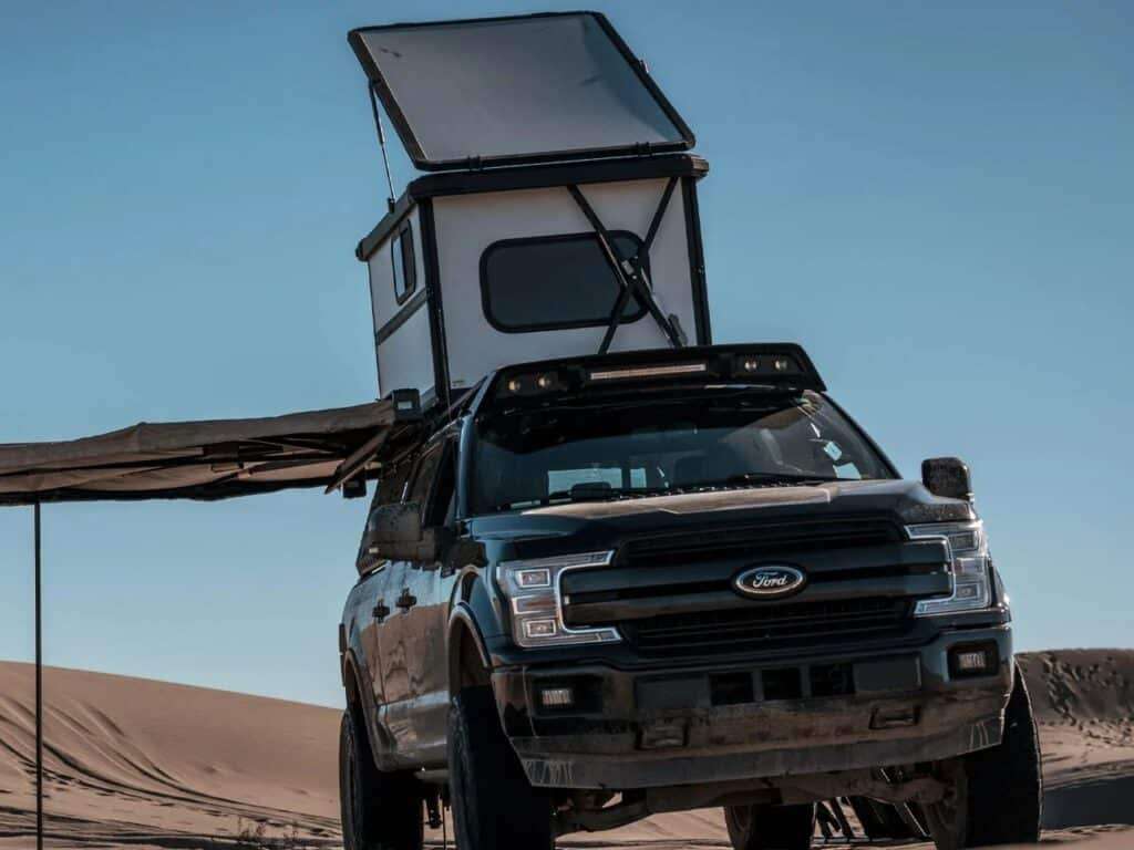 Altus hardwall rooftop cabin with its hinged roof fully raised, showing the interior height.