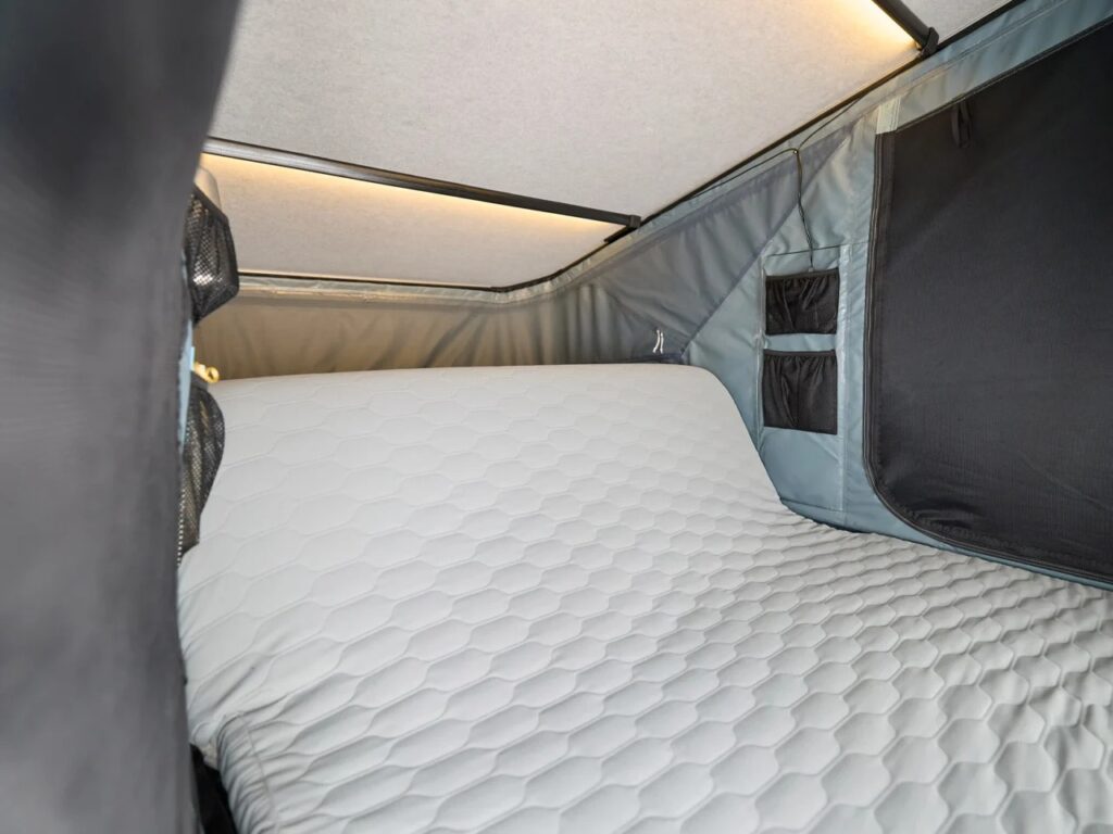 Detailed view of the Widesky tent's adjustable mattress being tilted into a seating position.