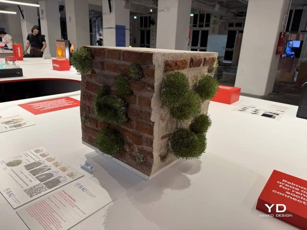 Full view of the Green Anarchy exhibition display with descriptive brochures and the wall model.