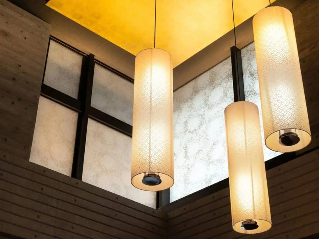 Close-up of cylindrical Washi paper pendant lights at Genji Kyoto.