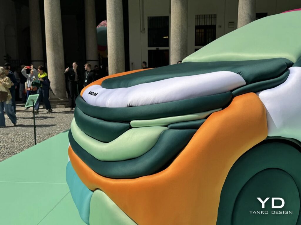 Close-up of the Skoda logo on a white inflatable tube at the front of the car.