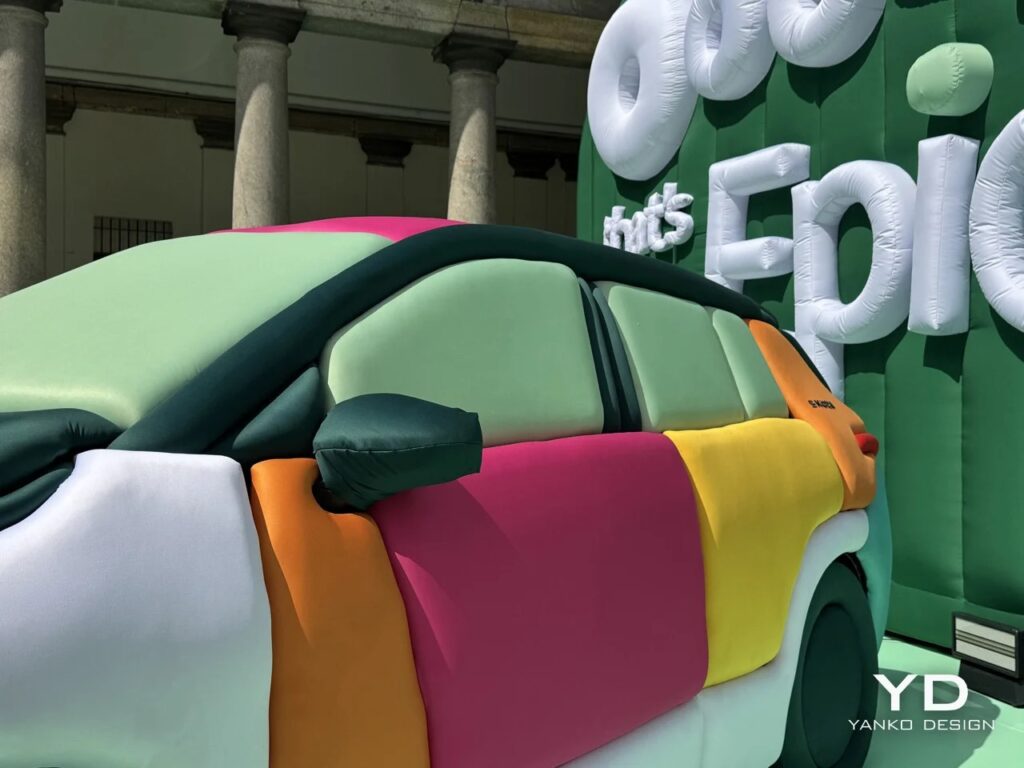 The Skoda Epiq inflatable car installation set against the historical columns of Palazzo del Senato with "Epic" inflatable lettering in the background.