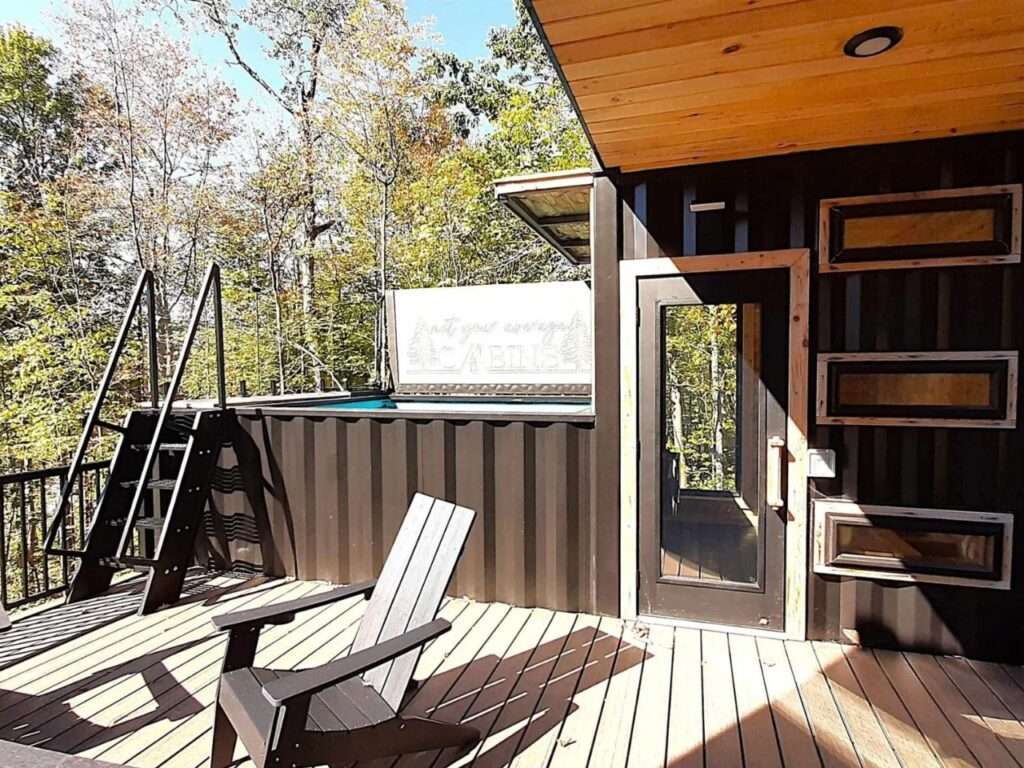 View of the rooftop wellness area at Fairmont Villa showing the sauna entrance and the exterior of the container pool.