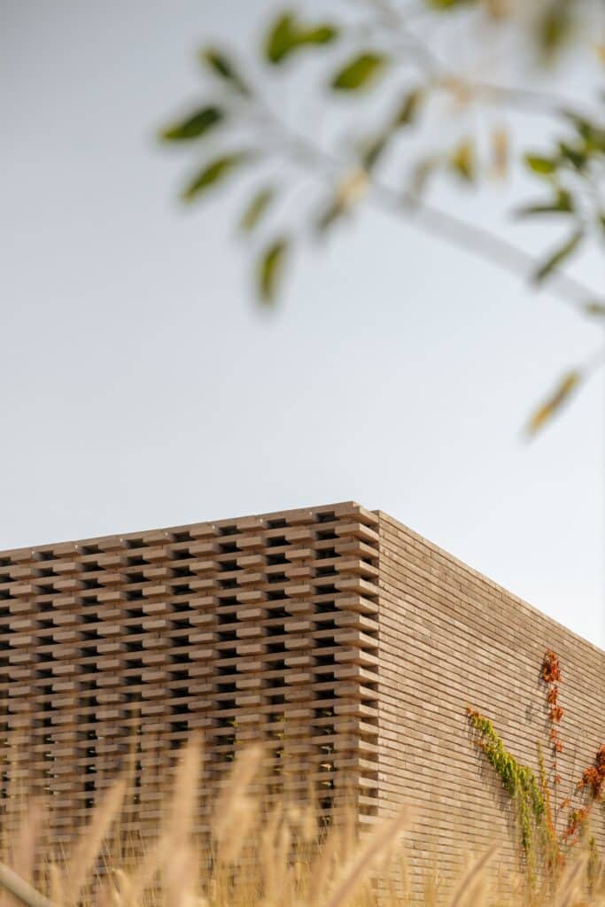 Geometric concrete block screen (brise-soleil) at Capuchinas House providing privacy and sunlight filtration.