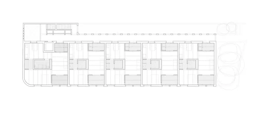 Detailed architectural floor plan showing the layout of 10 social housing units and the flexible multi-use ground floor spaces.