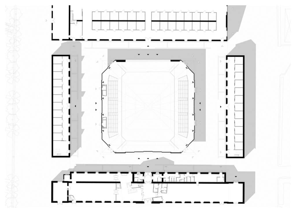 Architectural ground floor plan of the Hennebont equestrian hall showing the central arena and its relation to the surrounding historic stables.
