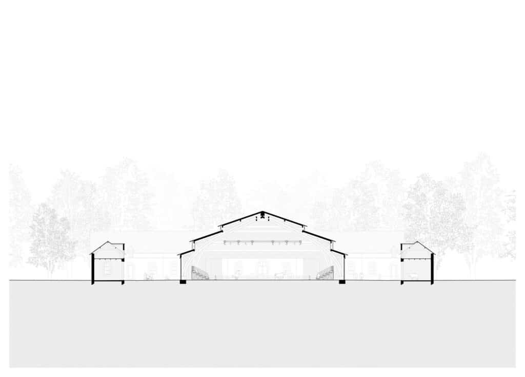 Technical section drawing of the Hennebont equestrian hall illustrating the thermal chimney effect and tiered roof structure.