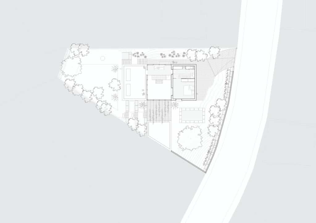 Detailed architectural site and first-floor plan showing the two blocks and the central atrium layout.