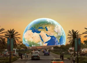 Giant Abu Dhabi Sphere model displaying global map in outdoor plaza