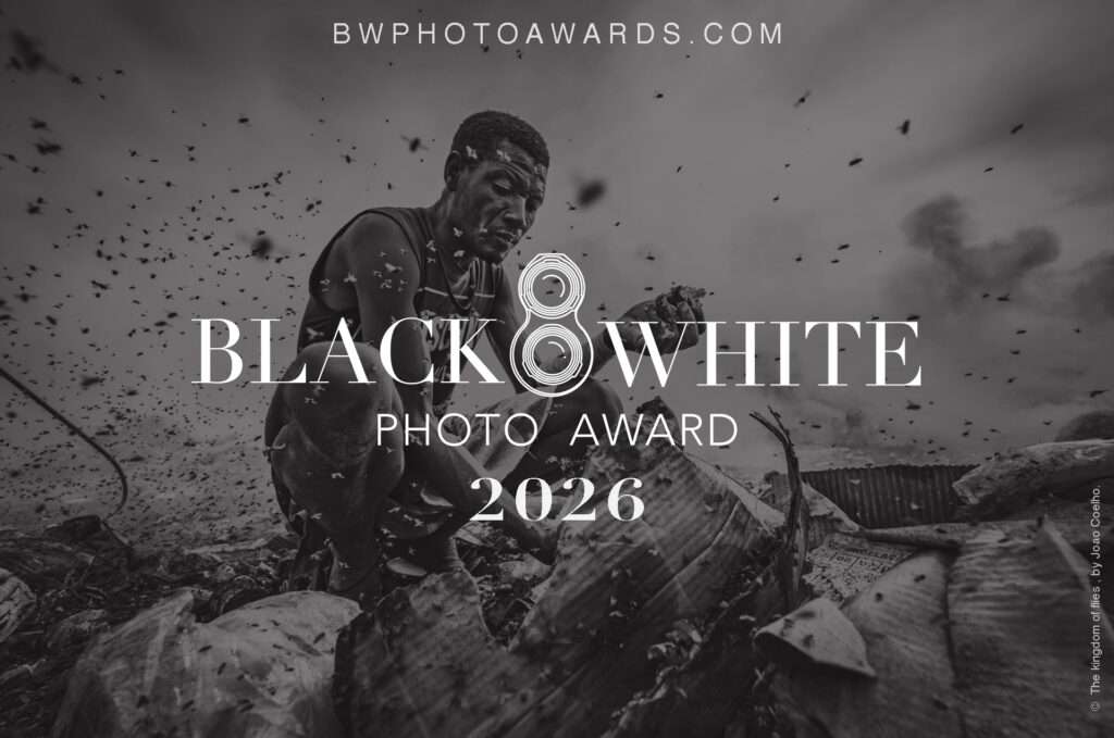 Black and White Photo Awards 2026 promotional poster celebrating international monochrome photography across architecture, street, portrait, landscape, and wildlife categories