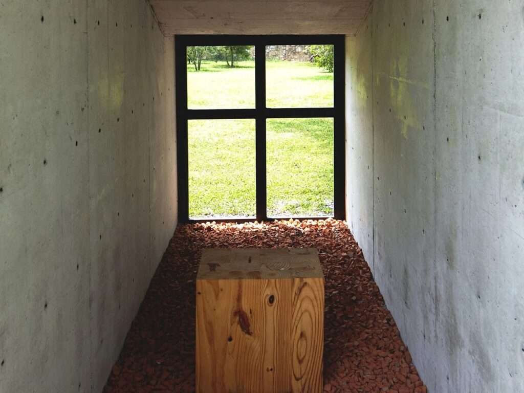 Interior detail of the Oratory Chapel showing the interplay between the concrete mass and the open void overlooking the garden.