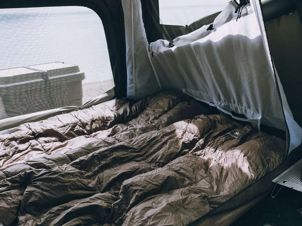 Interior of the Fire Rise RTT showing a two-person sleeping arrangement and the double-wall fabric structure.