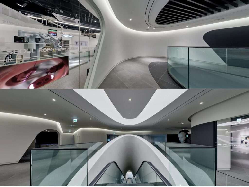 Internal split-view of RAIM showing fluid, white curved walls, minimalist pathways, glass balustrades, and a central architectural escalator system reminiscent of a spaceship.