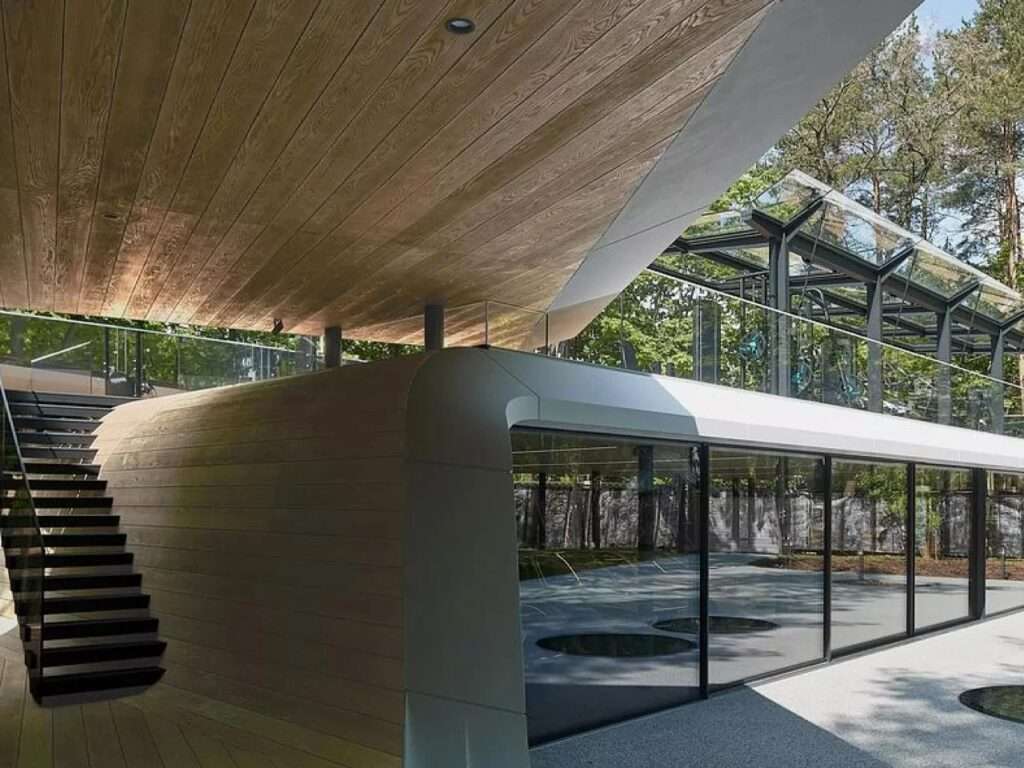 Close-up of the architectural transition between the wooden interior ceiling and the white Corian exterior of the Möbius garage.