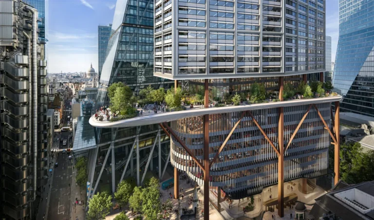 An elevated public garden on the eleventh floor of a high-rise tower with views of surrounding city structures.