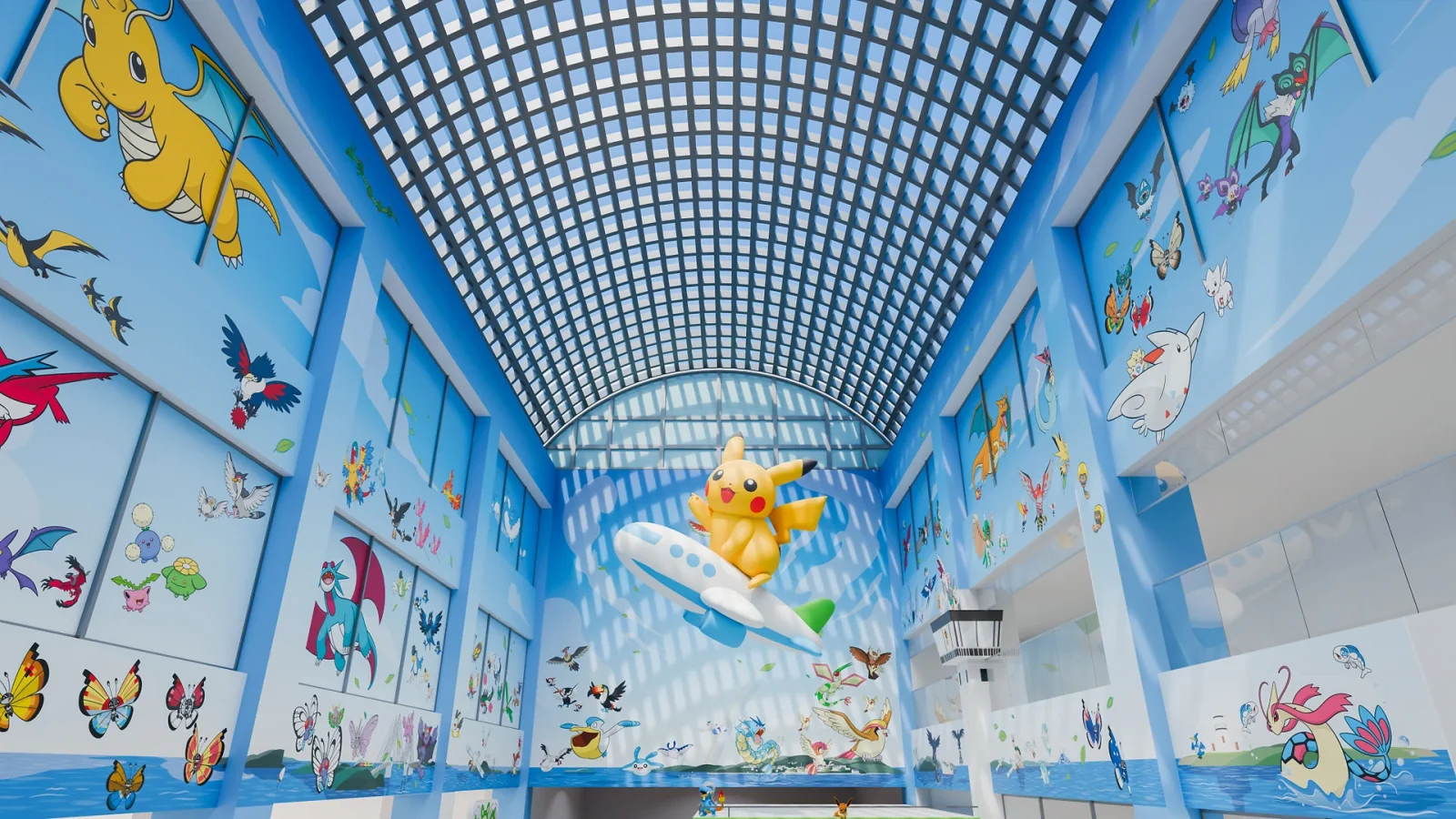 A large interior airport atrium featuring a suspended central sculpture and extensive graphic wall panels.