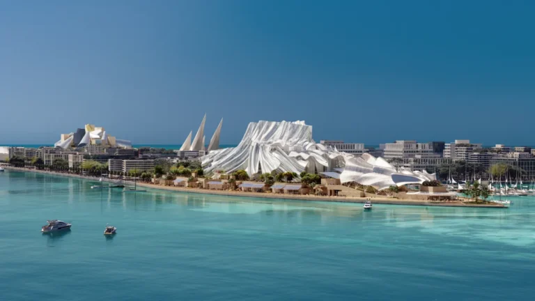 Aerial view of Dar Al Funoon Arts Institution with its undulating massing on the waterfront of Saadiyat Island.