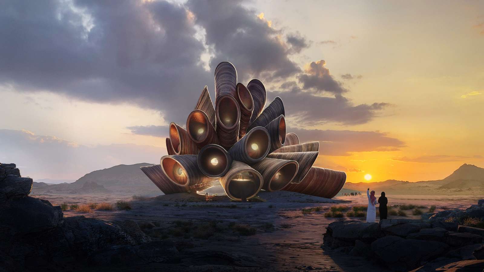An architectural massing of interlocking tubular stone forms in a desert landscape during sunset.