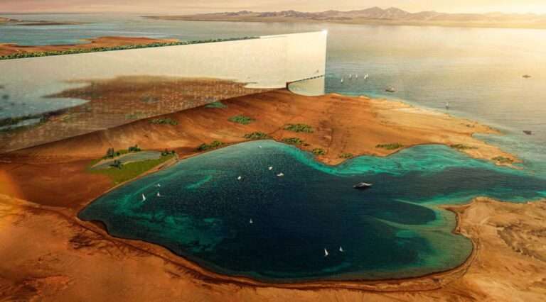 Aerial rendering of a massive mirrored linear megastructure cutting through a desert landscape next to a blue lagoon.
