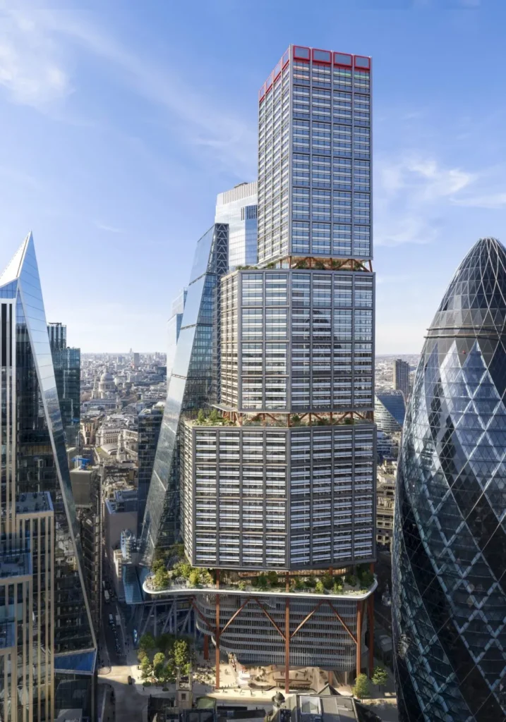 A full-height view of a modern skyscraper composed of stacked volumetric blocks within a dense urban skyline.