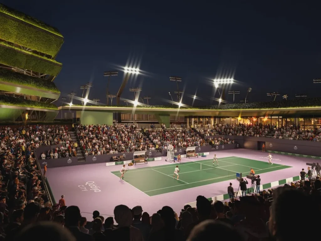 A tennis match illuminated by large stadium floodlights at night, with full spectator stands.