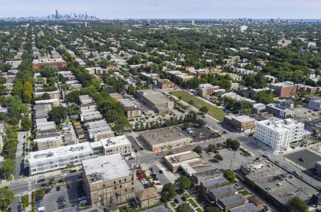 An aerial view of the Auburn Gresham neighborhood showing historic low-rise homes and the new development.